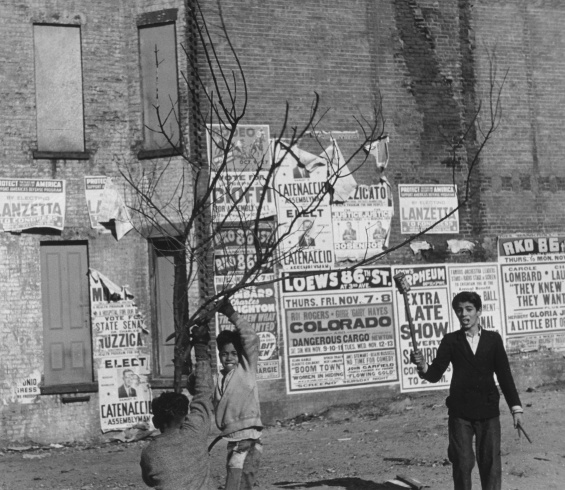 Helen Levitt, "New York (Boys Playing in Front of Posters)", 1939